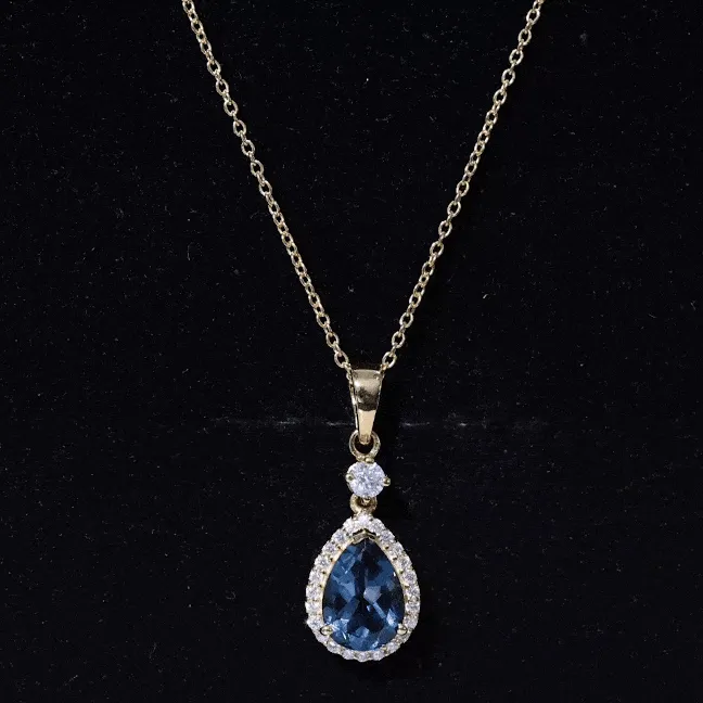 4.25 CT London Blue Topaz and Moissanite Halo Pendant Necklace