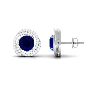 Created Blue Sapphire and Diamond Swirl Stud Earrings