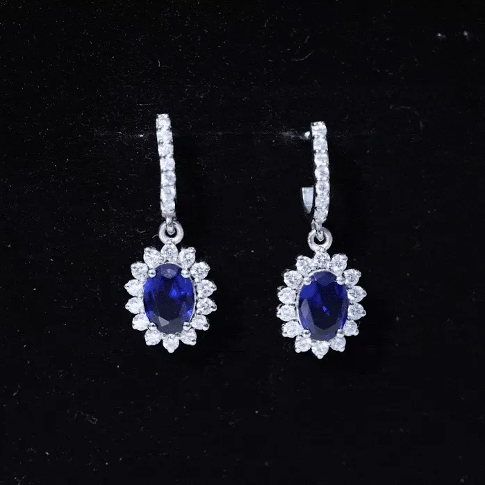 Oval Created Blue Sapphire J Hoop Earrings with Moissanite Halo