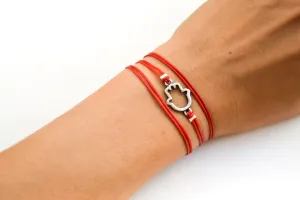 Red wrapped bracelet with a silver Hamsa charm, Kabbalah bracelet